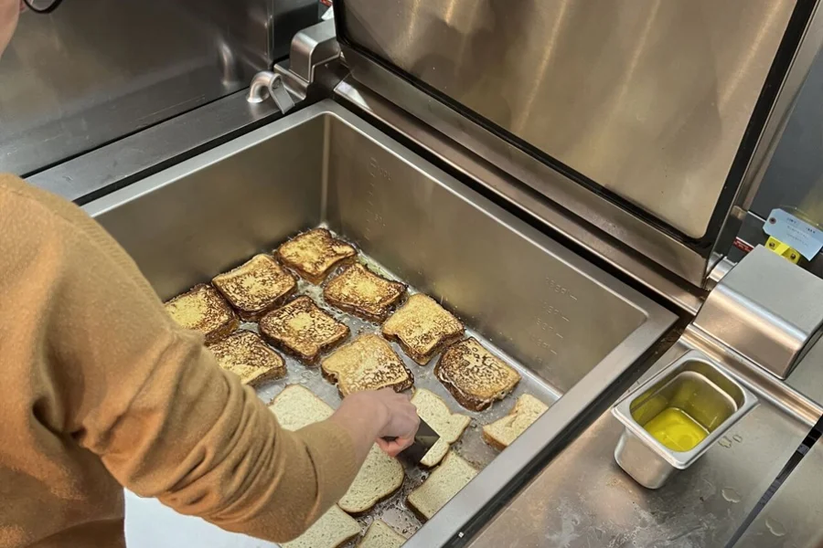 Commercial tilting braising pan cooking stew in catering facility