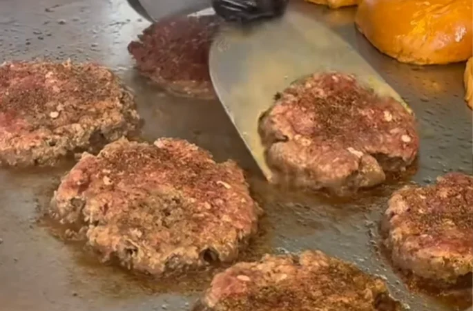 Professional kitchen with a commercial induction griddle in use